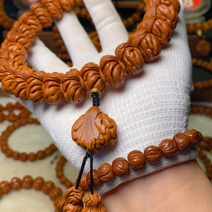 阳***哥桃核手串秦岭龙纹桃核