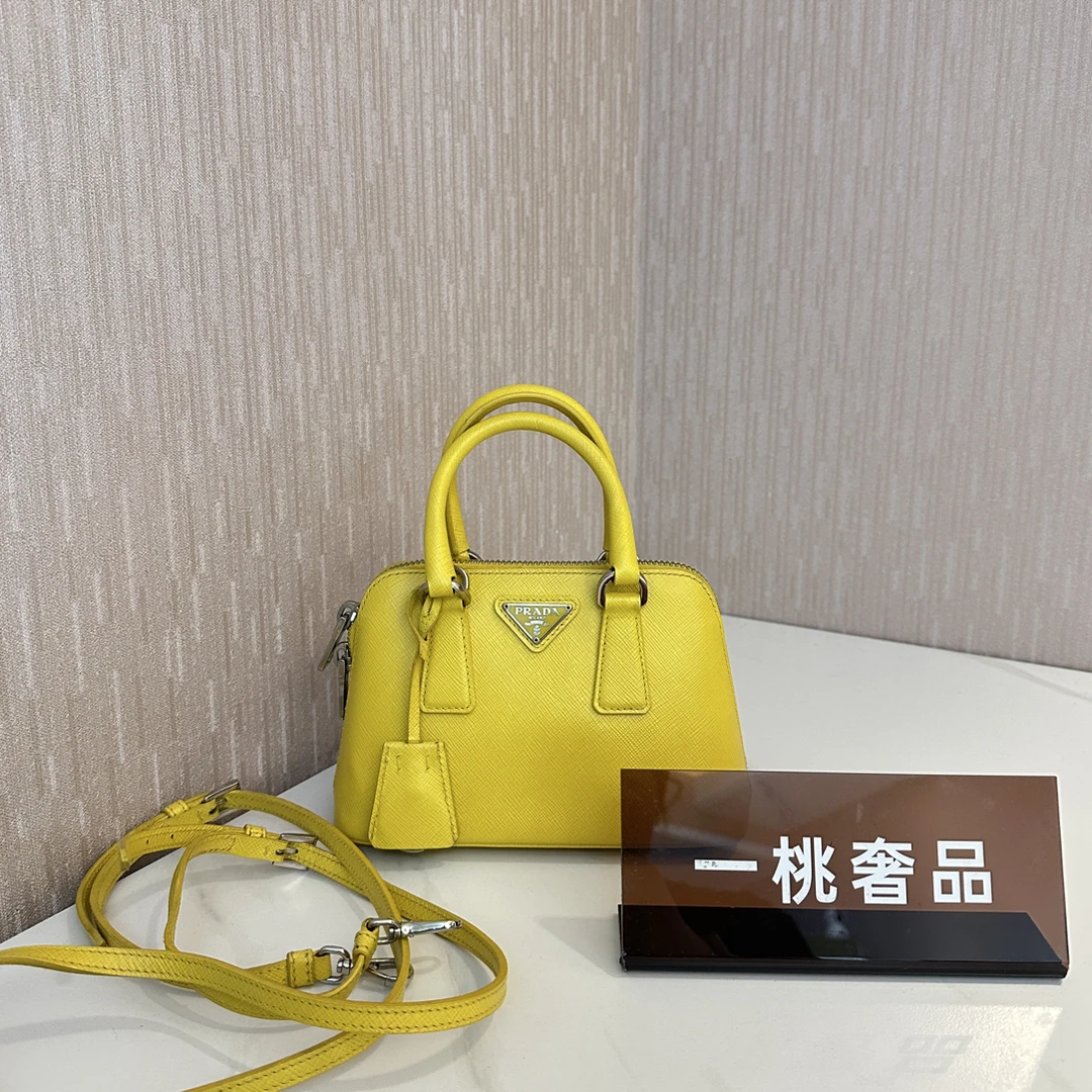 95新 Prada/普拉达 一桃/普拉达 明黄色迷你贝壳手提斜挎