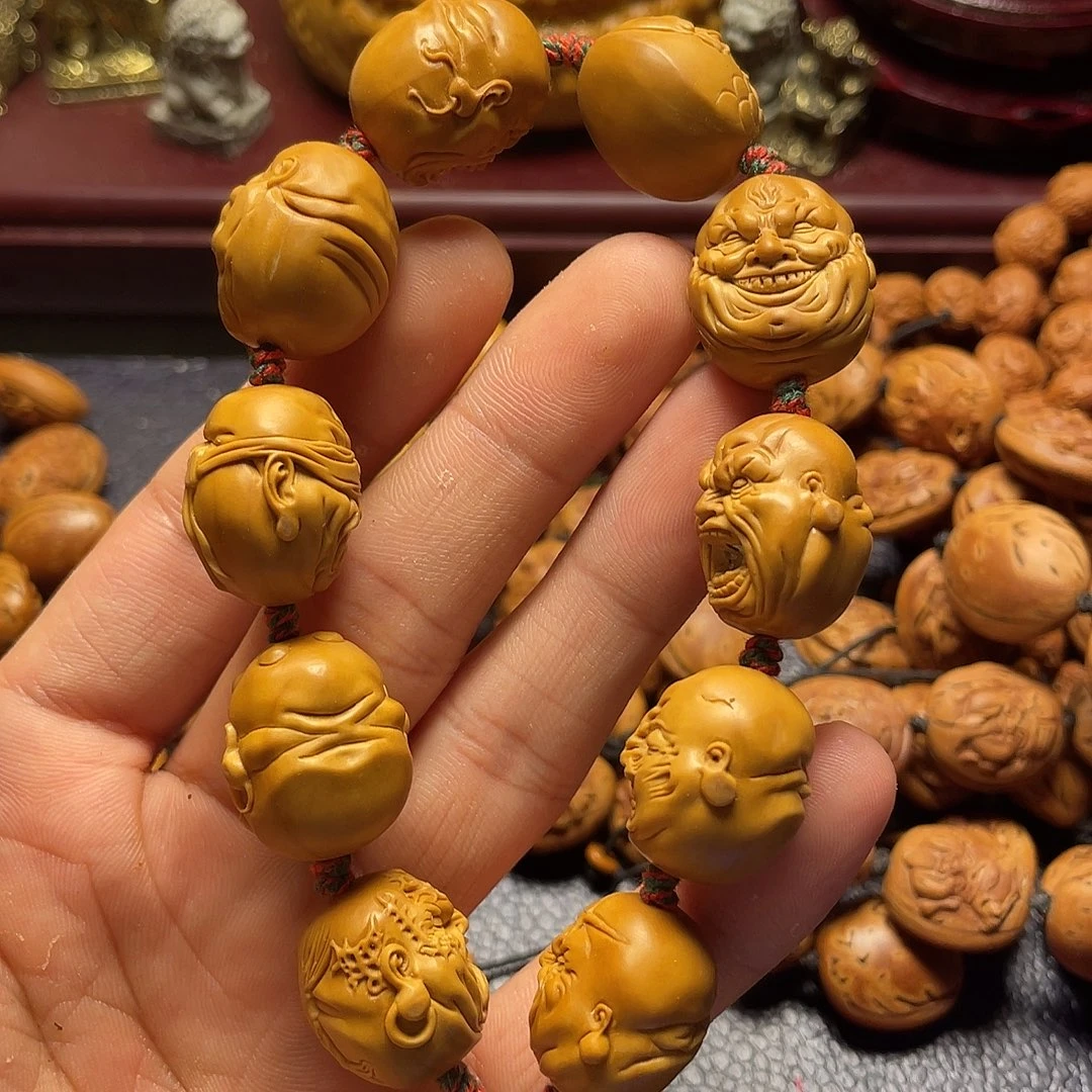 一***舞橄榄核雕刻恶僧手串