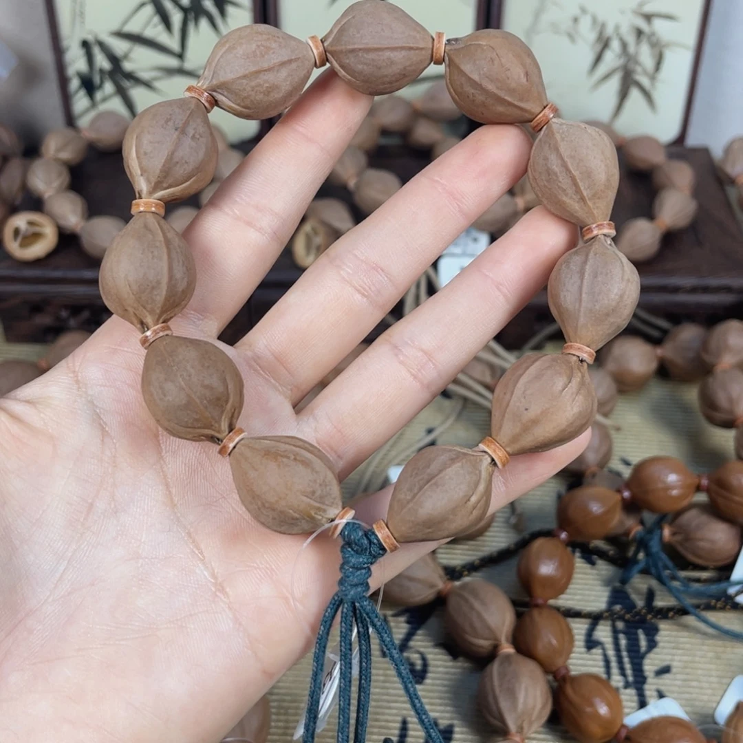 R***k手串橄榄核梅林铁核1723三面佛