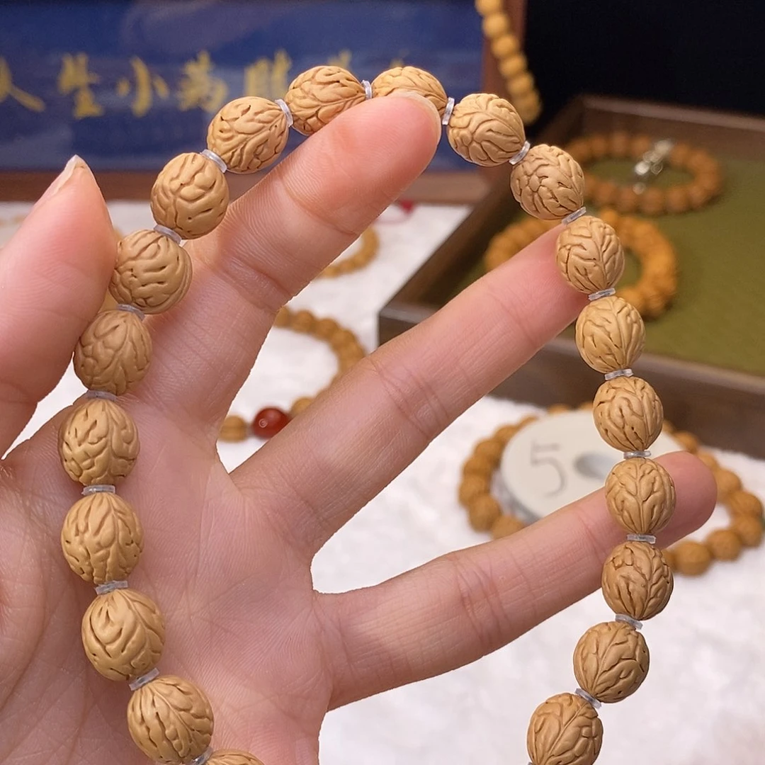 春***艺桃核手串10大肠纹钱袋子