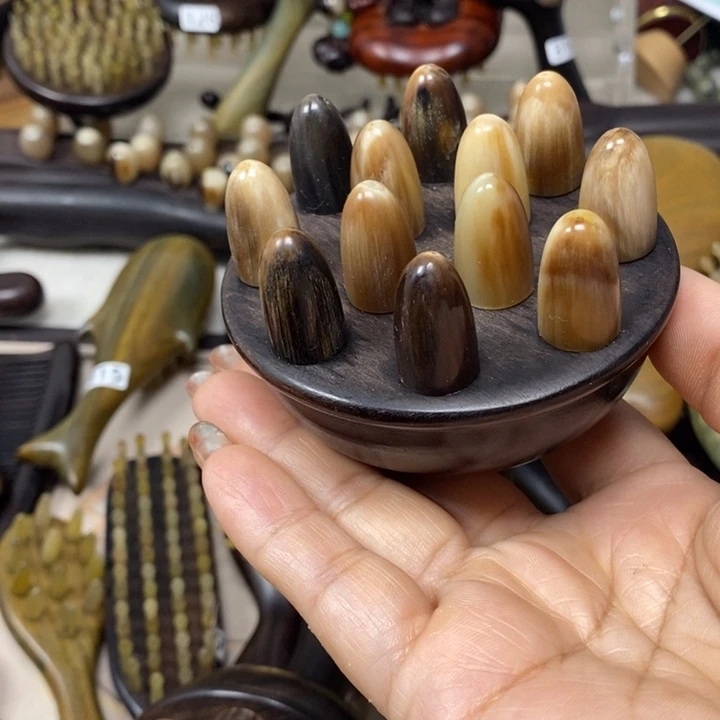 紫光檀12齿牛角铃铛梳