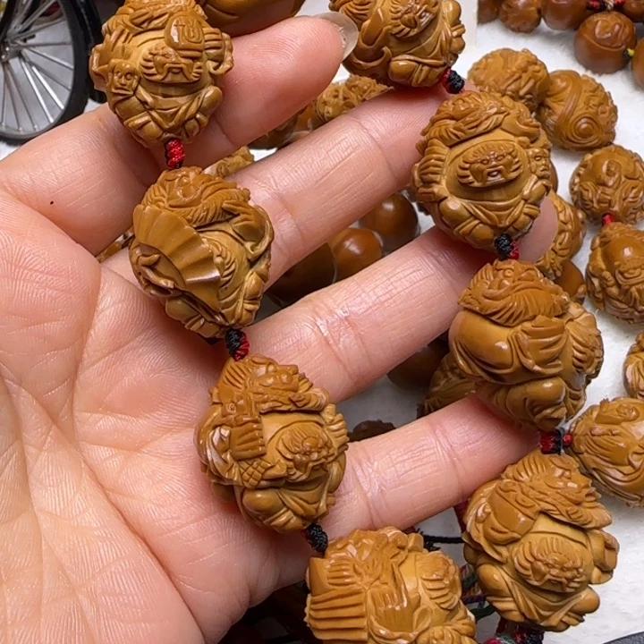 猛***笼橄榄核吊坠橄榄核雕橄榄核