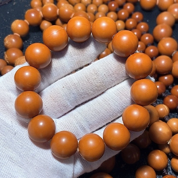 M**何橄榄核正圆光珠特价串1.5