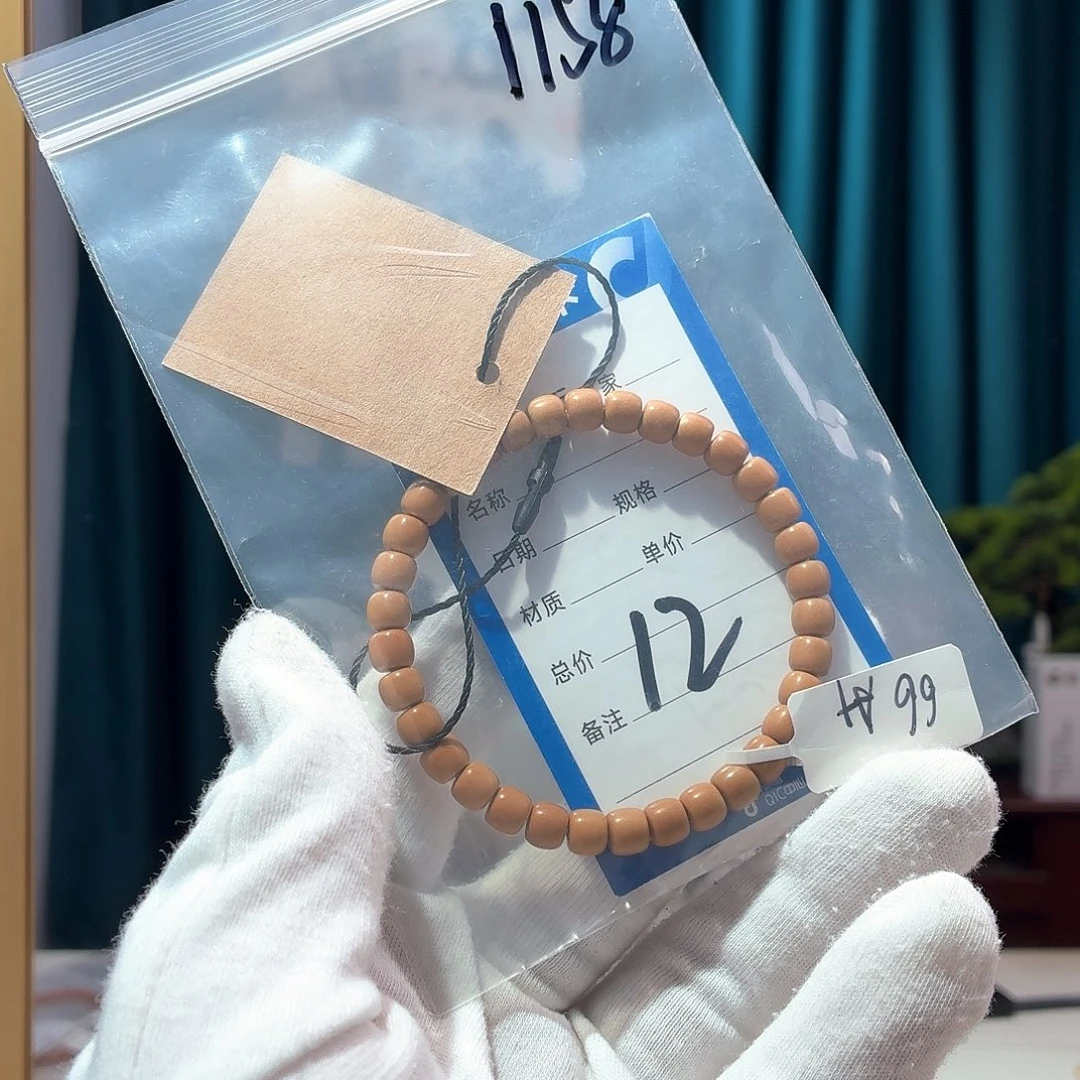 Q***生紫金鼠手串核尖6.6