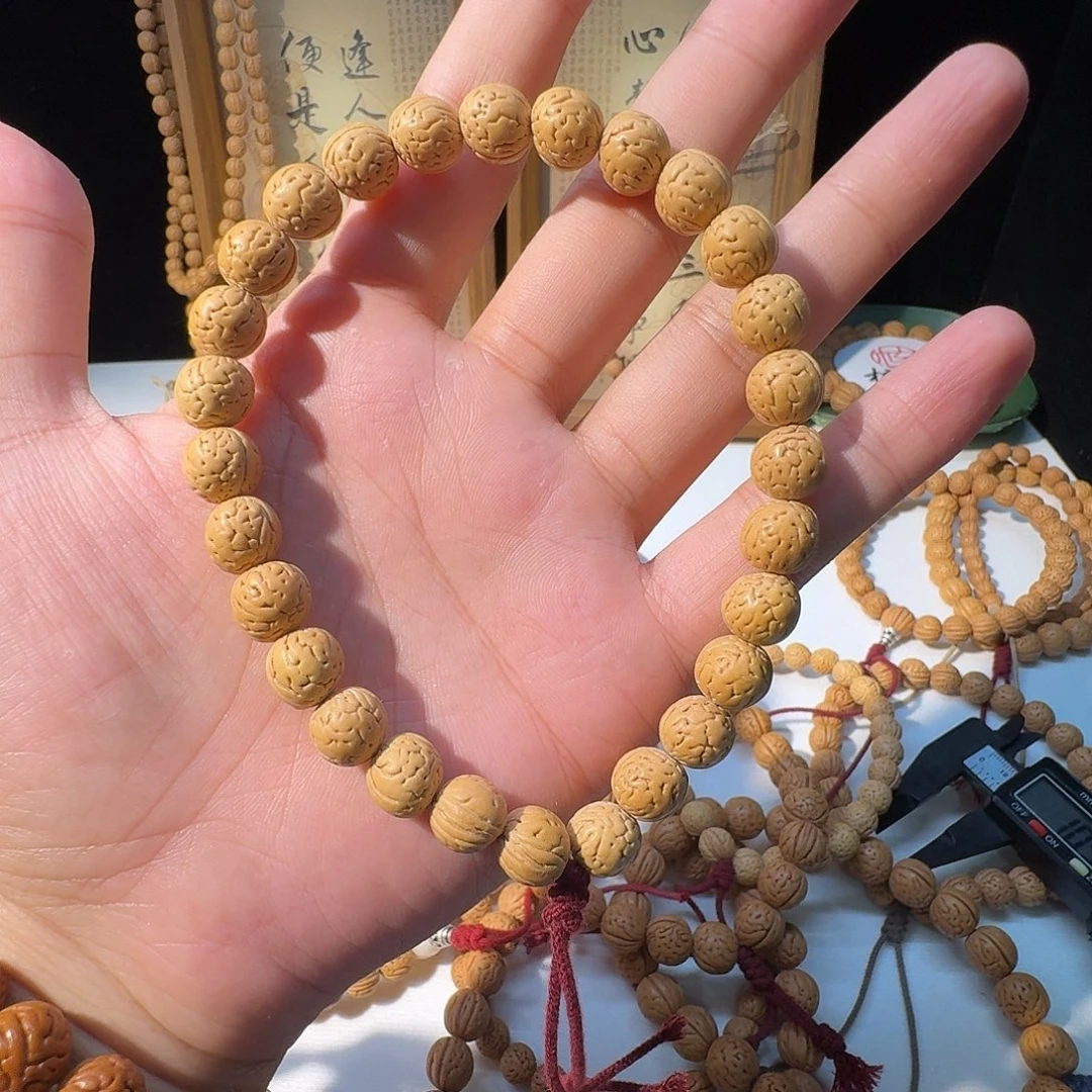 丁***糖桃核吊坠野生小黄桃