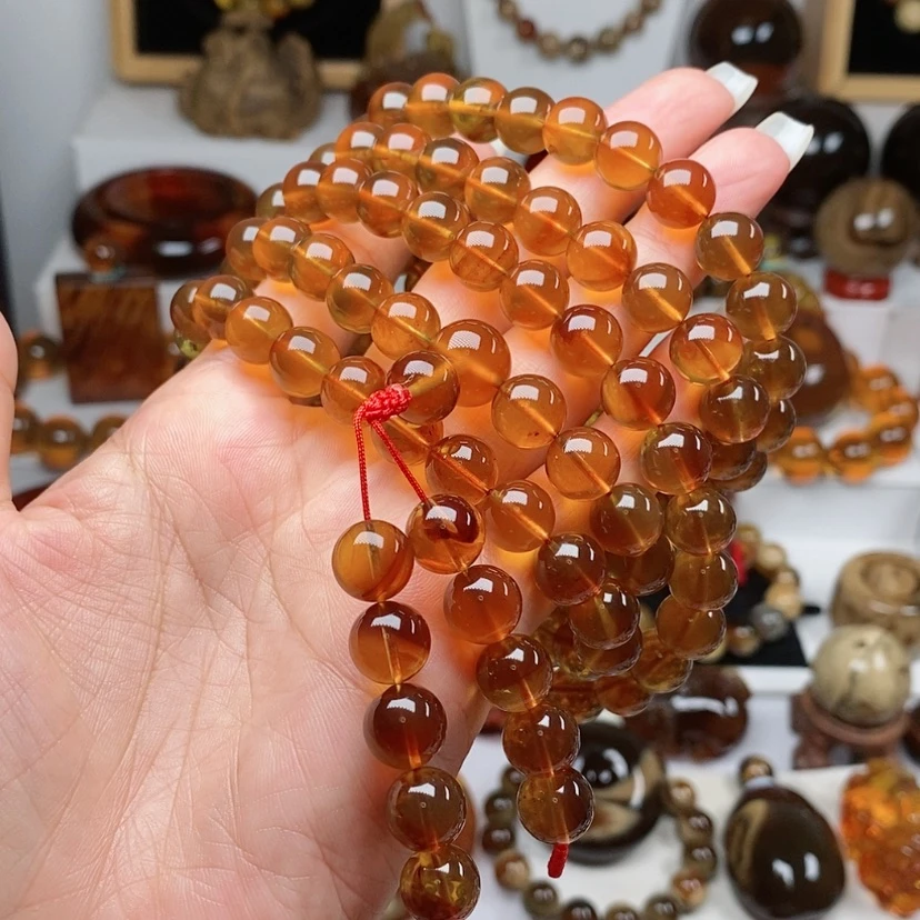 【闪购商品】手串琥珀未镶嵌70.4克，金棕红108