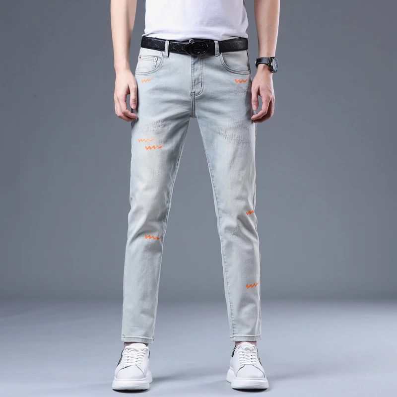 做旧水洗破洞男士牛仔裤春夏季潮韩版涂鸦百搭青年修身小脚九分裤