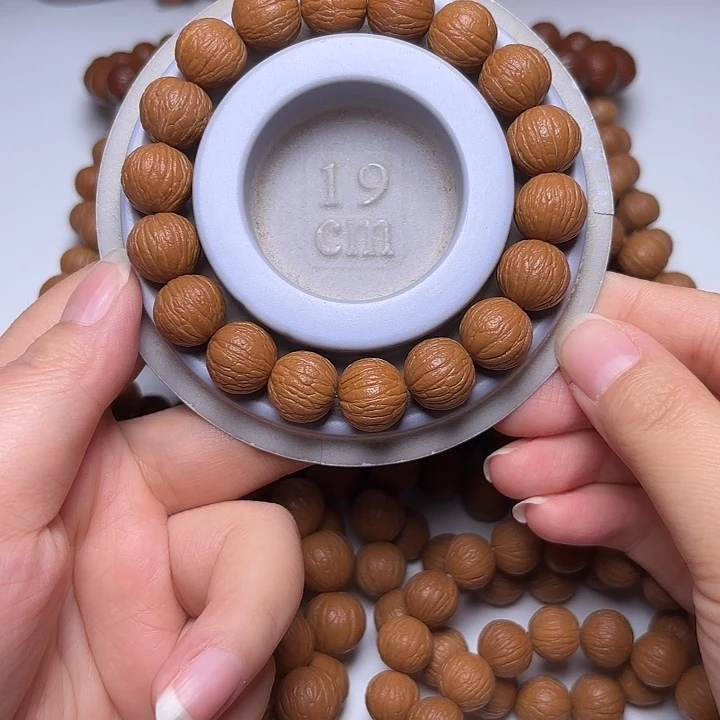 霍***达猴头核桃吊坠14+同尺凤羽手串