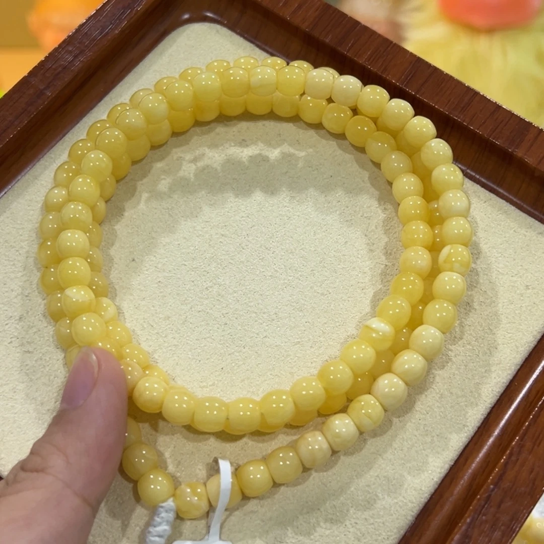 D***k蜜蜡未镶嵌手链6.5m黄白花直切108