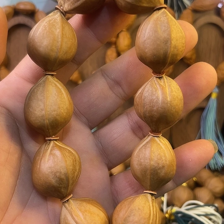 小***u手串橄榄核梅林铁三面佛