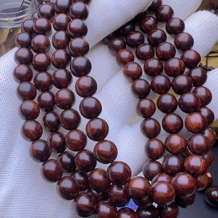 木湫***?海南红降黑金满纹0.8的108芝麻点