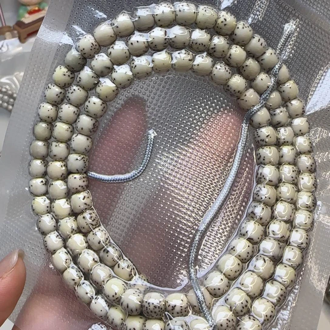 星月菩提手串石玉河豚7×6长条108