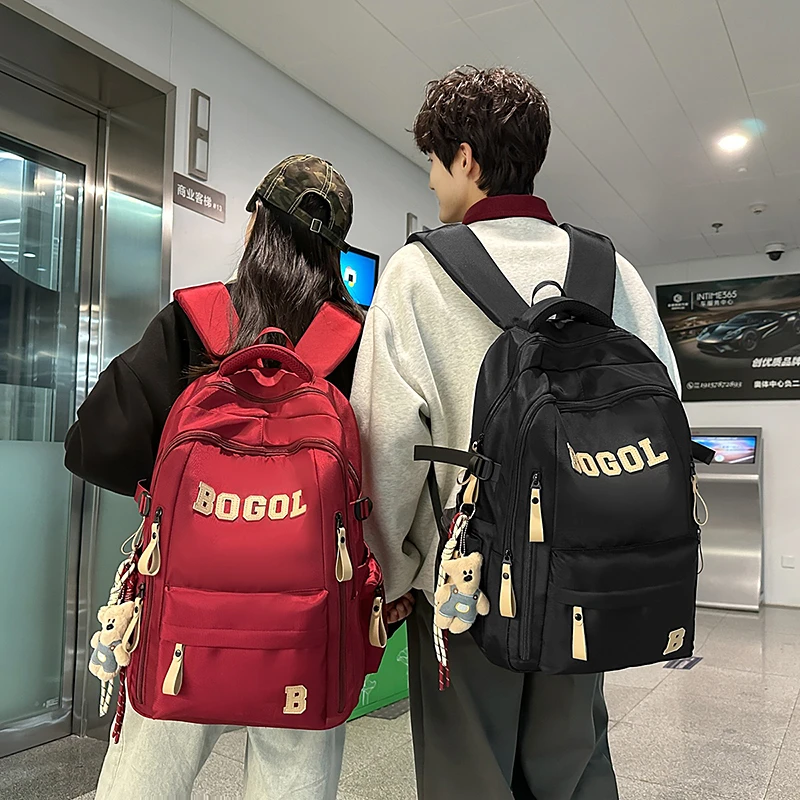 书包男初中生小学生高中生女大容量减负护脊轻便专用大学生双肩包