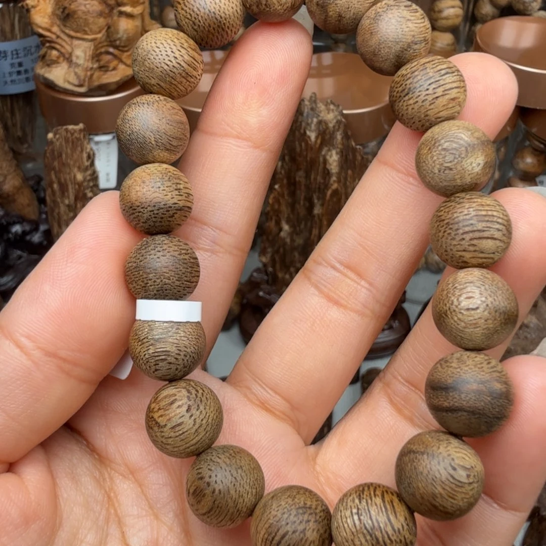 沉香沉香碎屑文莱黑棋蛇皮纹 九分沉 1.1*11.2 克