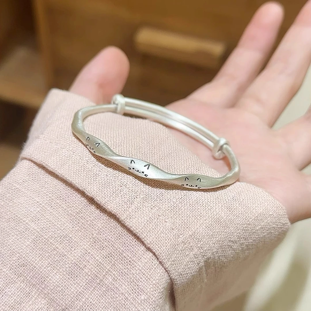 梵际 足银手镯 足银999.9磨砂做旧扭纹激光猫咪笑脸实心纯银手镯