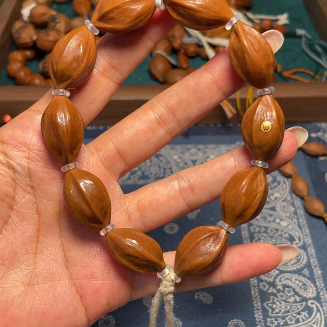 橄榄核吊坠铁核金标三面佛