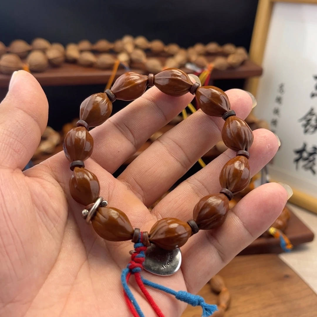 玩***家橄榄核手串三面佛