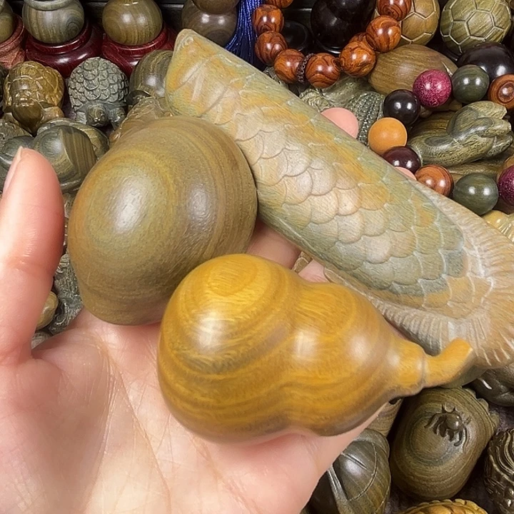 知***人木阿根廷绿檀木手把件