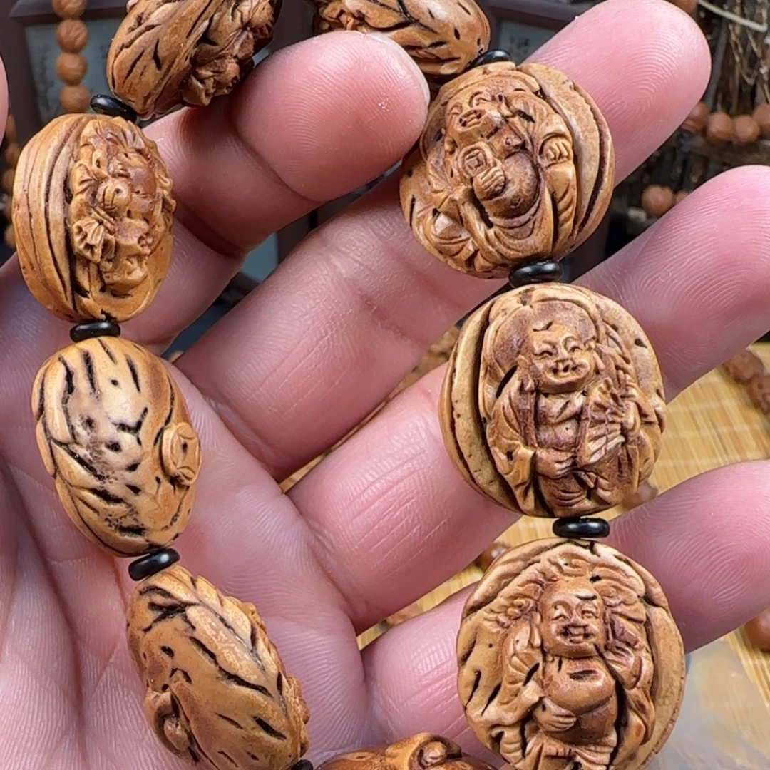 大桃核雕刻财神一颗弥勒8颗手串