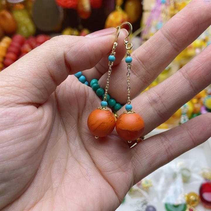 =***）无非金属88号橘色耳线