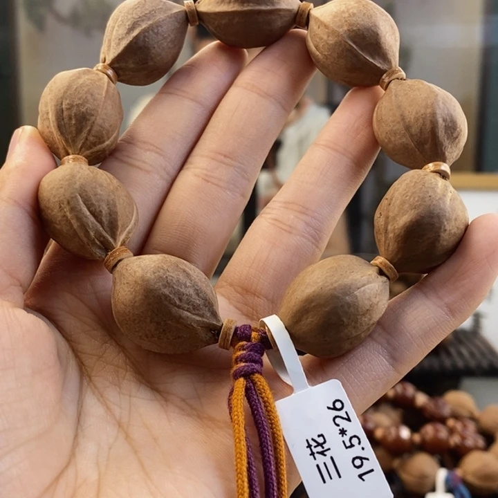 橄榄核吊坠低***鸭梅林铁