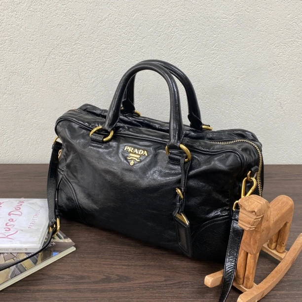 95新 Prada/普拉达 黑金油蜡皮波士顿手提斜挎包底长34 118760