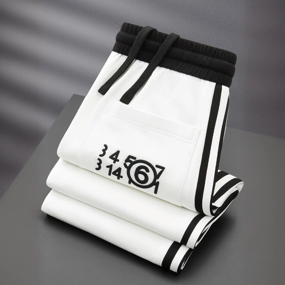 GUNEBOLURWA秋季薄款柔顺莫代尔卫裤男直筒小脚侧边织带运动裤男