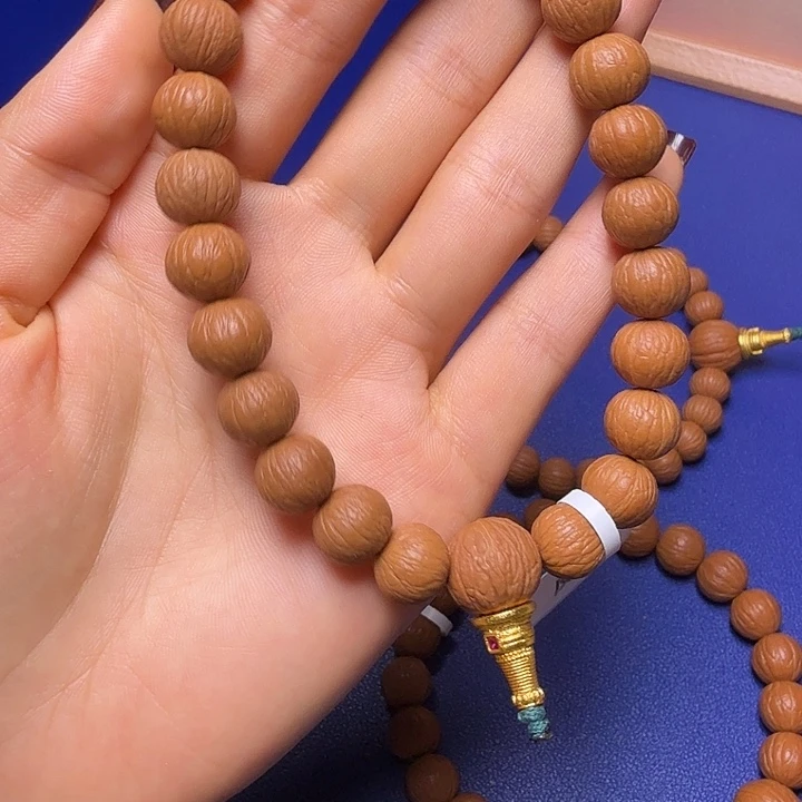 嘻***嘻吊坠猴头核桃凤羽