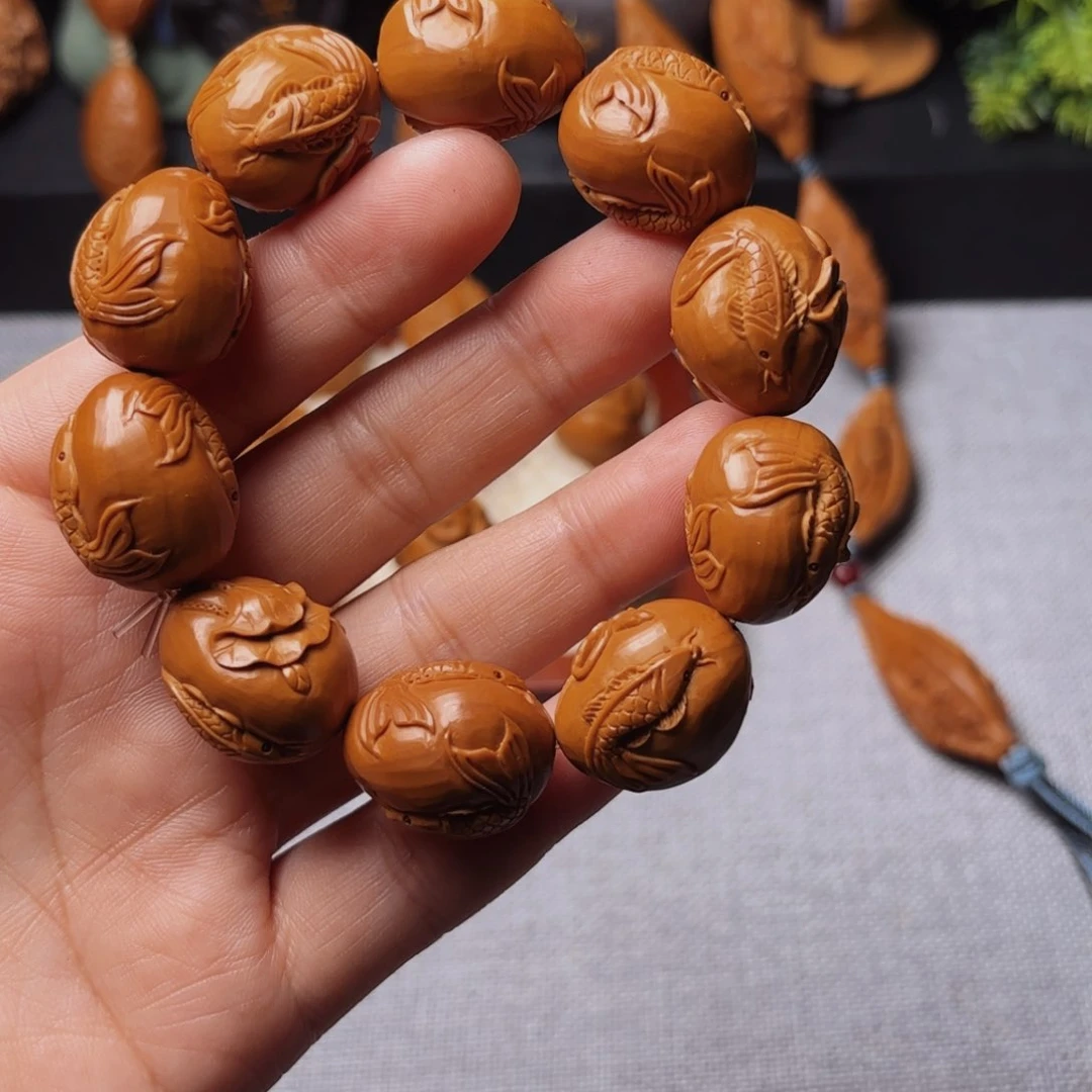 橄榄核手串/手链荷花鱼