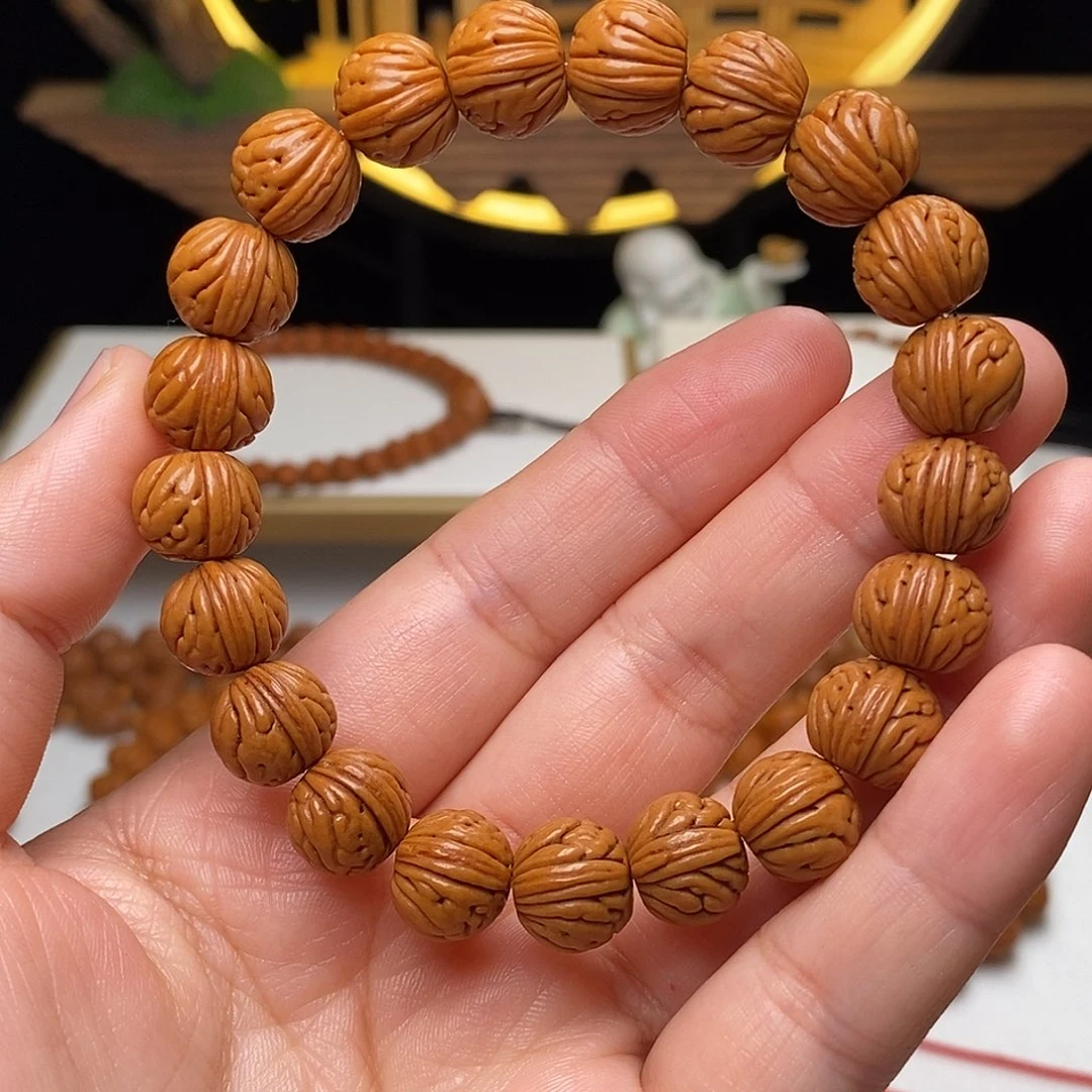 桃核手串11mm野生金麒麟桃核手串