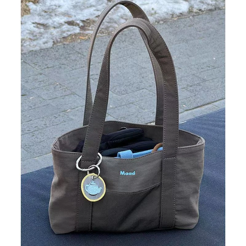 时尚小众通勤托特包单肩大容量尼龙法棍包女休闲手提旅行腋下Q