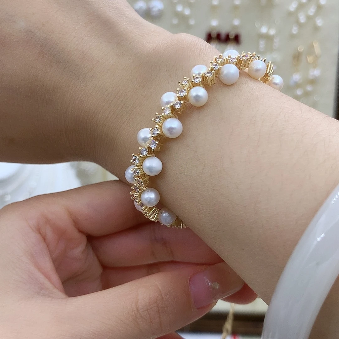 淡水珍珠银S925镶嵌耳饰