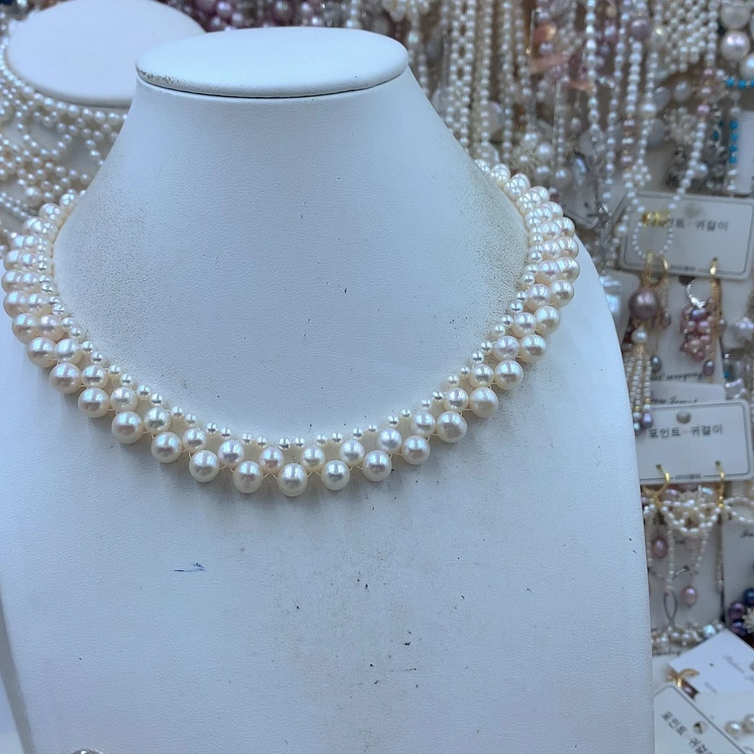 钱***万淡水珍珠耳饰银S925镶嵌