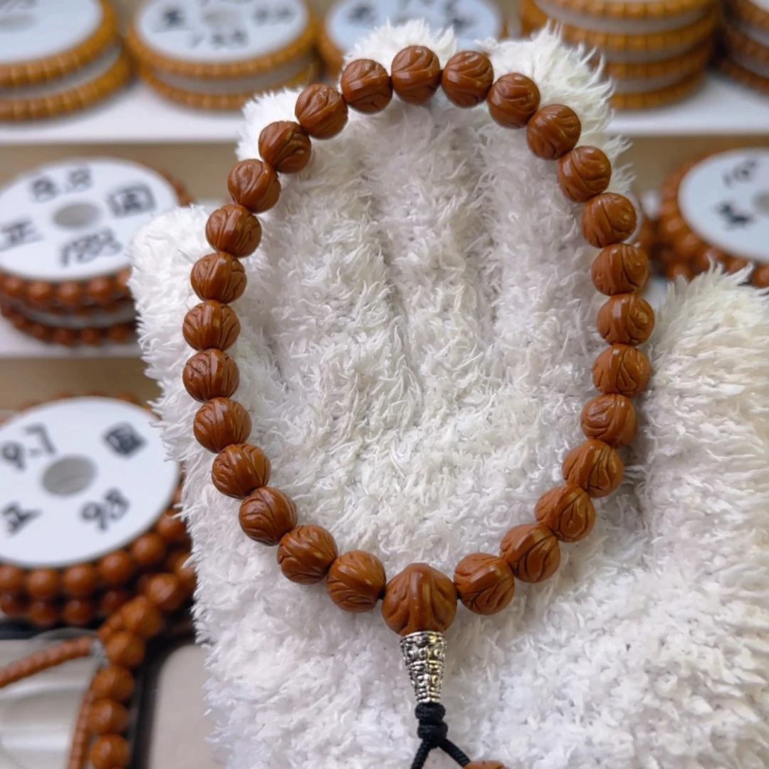 桃核手串走****航龙纹桃核原皮手持