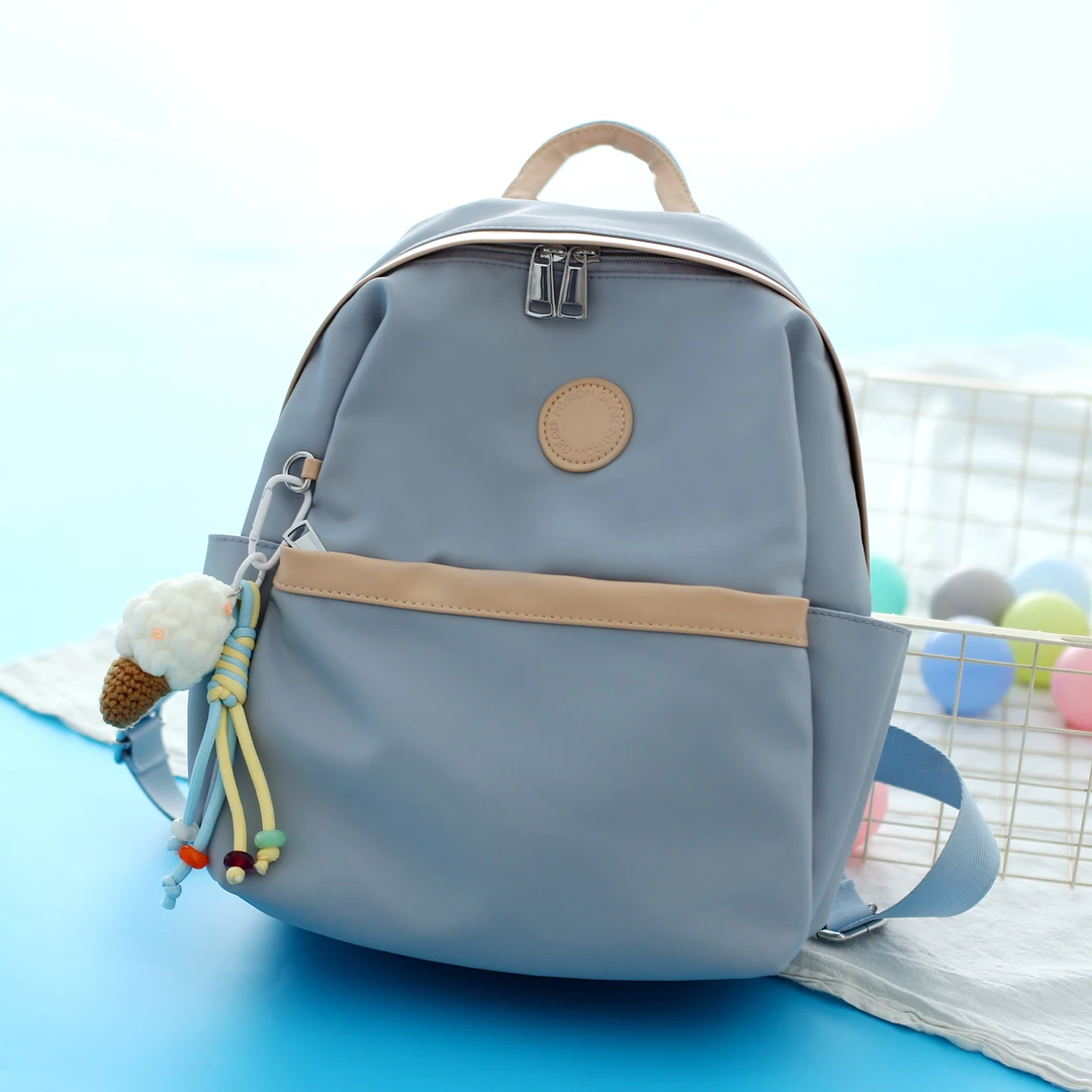 日系中号双肩包女轻便旅游小背包通勤上班简约书包外出带娃妈咪包