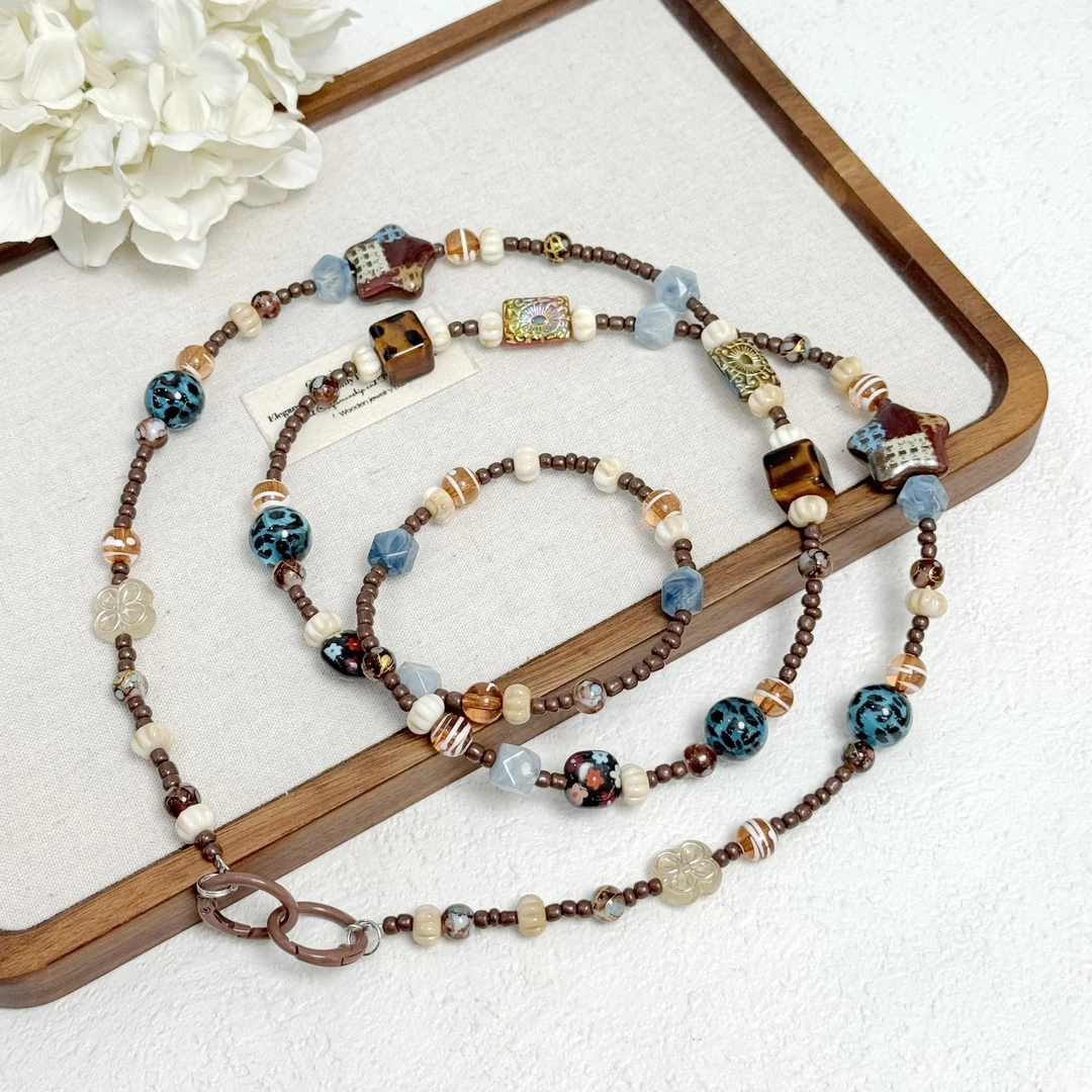 BAOSHATI/宝莎缇F-1028美拉德色系时尚豹纹串珠星星手机链