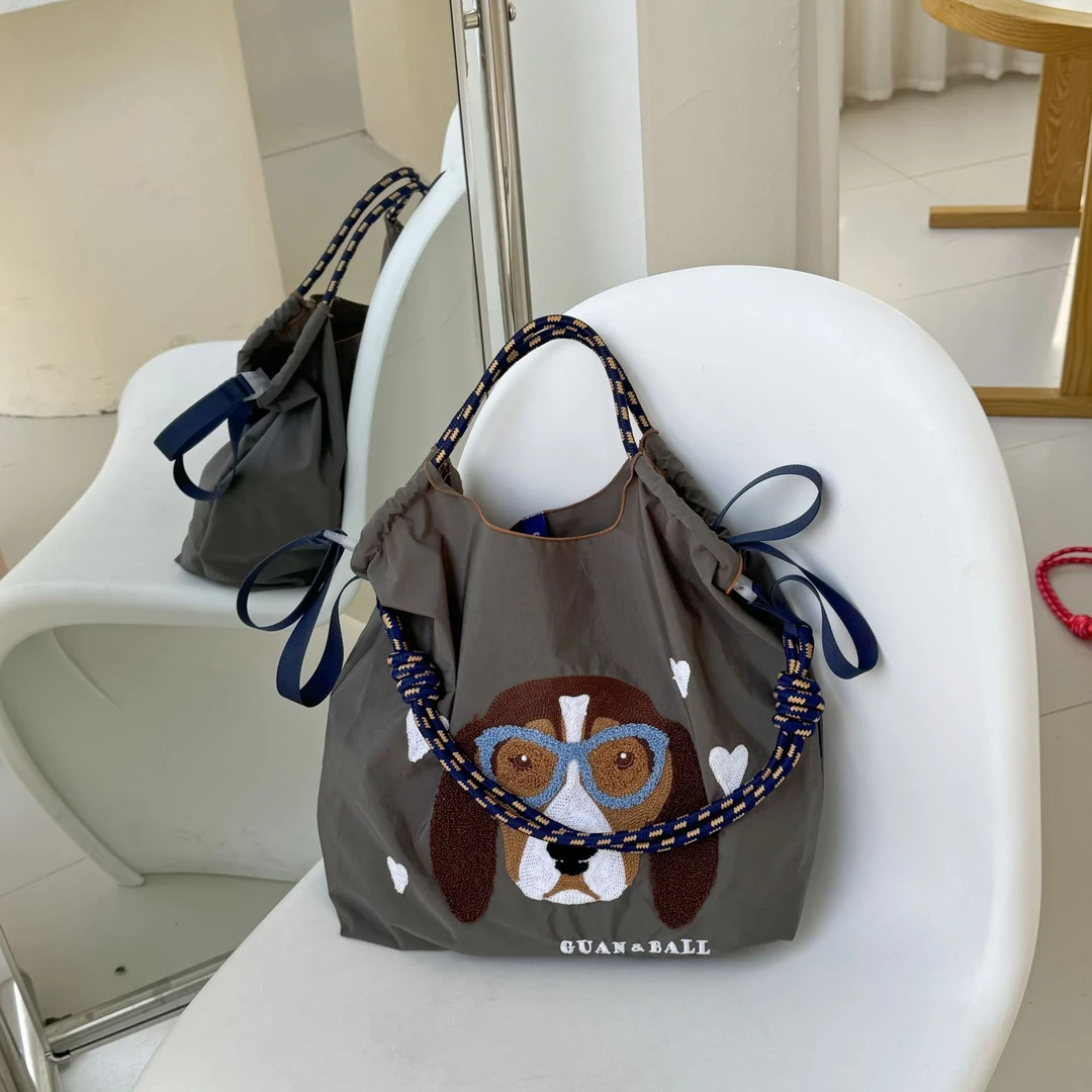 眼睛狗手提包爆款百搭水桶包时尚休闲夏季小众单肩手拎包肩包简约