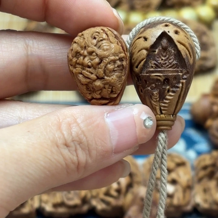 A***爷桃核雕刻罗汉和无相三通