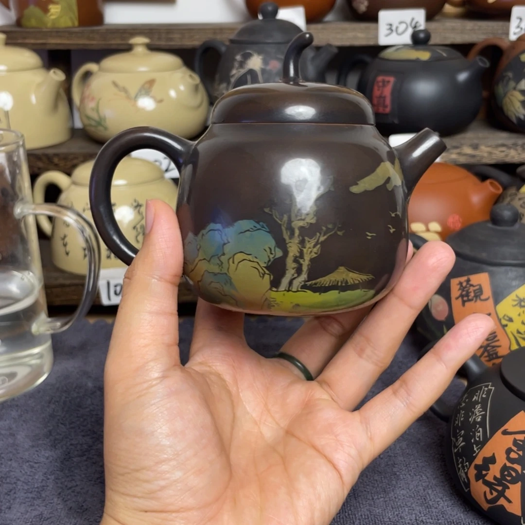 我***？壶高亮刻填山水茄瓜壶