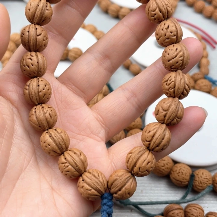 江***起12.8尺寸野生桃核手持