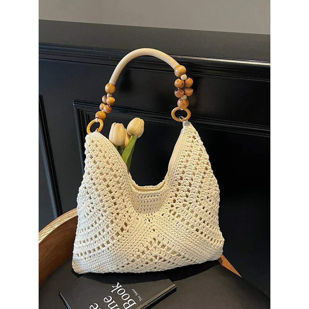 手工镂空编织包包女式2025新款海边度假沙滩包流行通勤单肩托特包