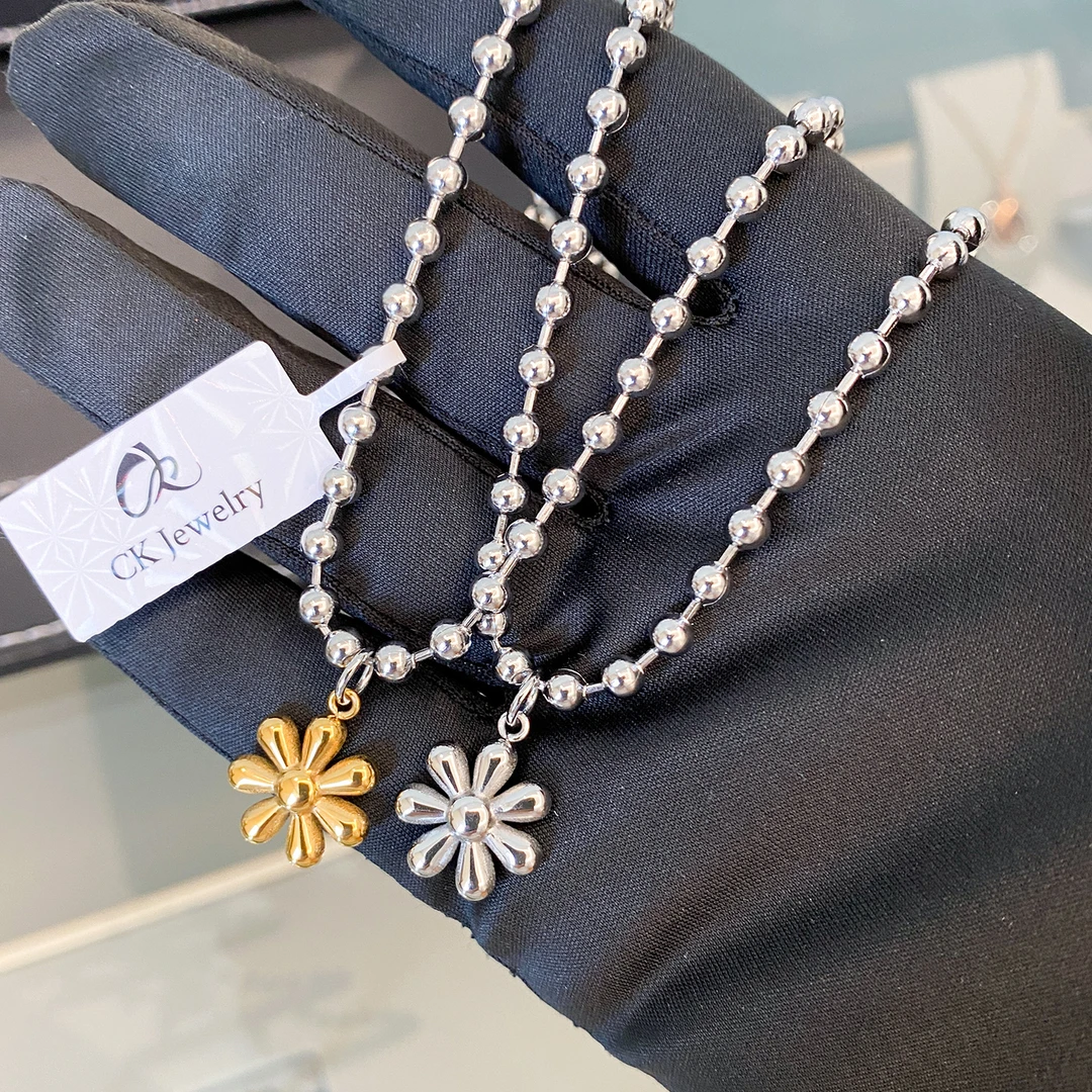 CK 钛钢吊坠 七瓣太阳花元气吊坠男女项链小众情侣毛衣链节日礼物