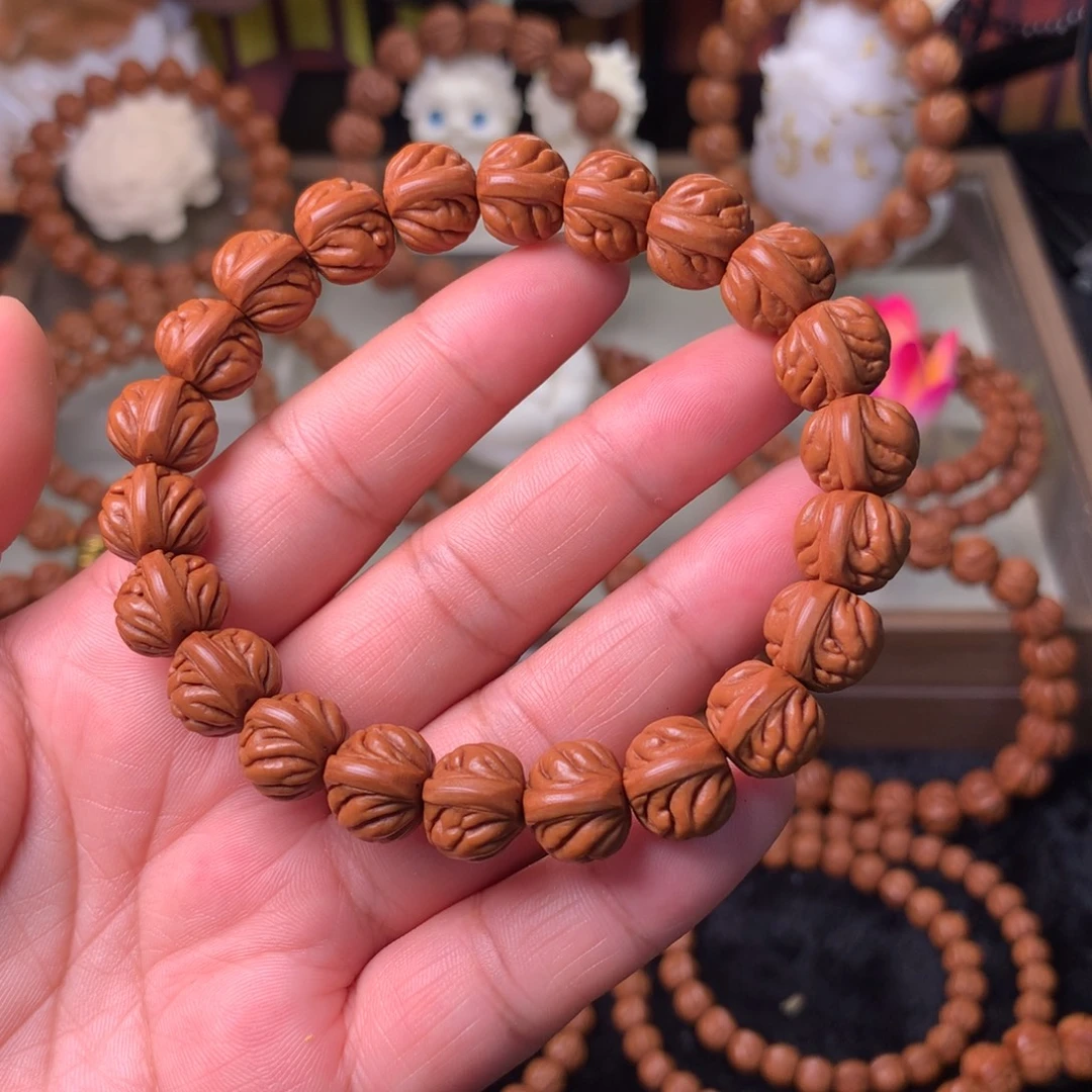 姜***人桃核吊坠双脊龙手串12