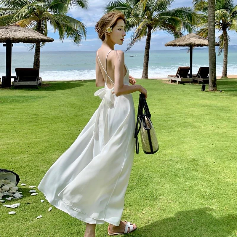 三亚海边旅行穿搭度假沙滩裙超仙女露背吊带长裙缎面蝴蝶结连衣裙