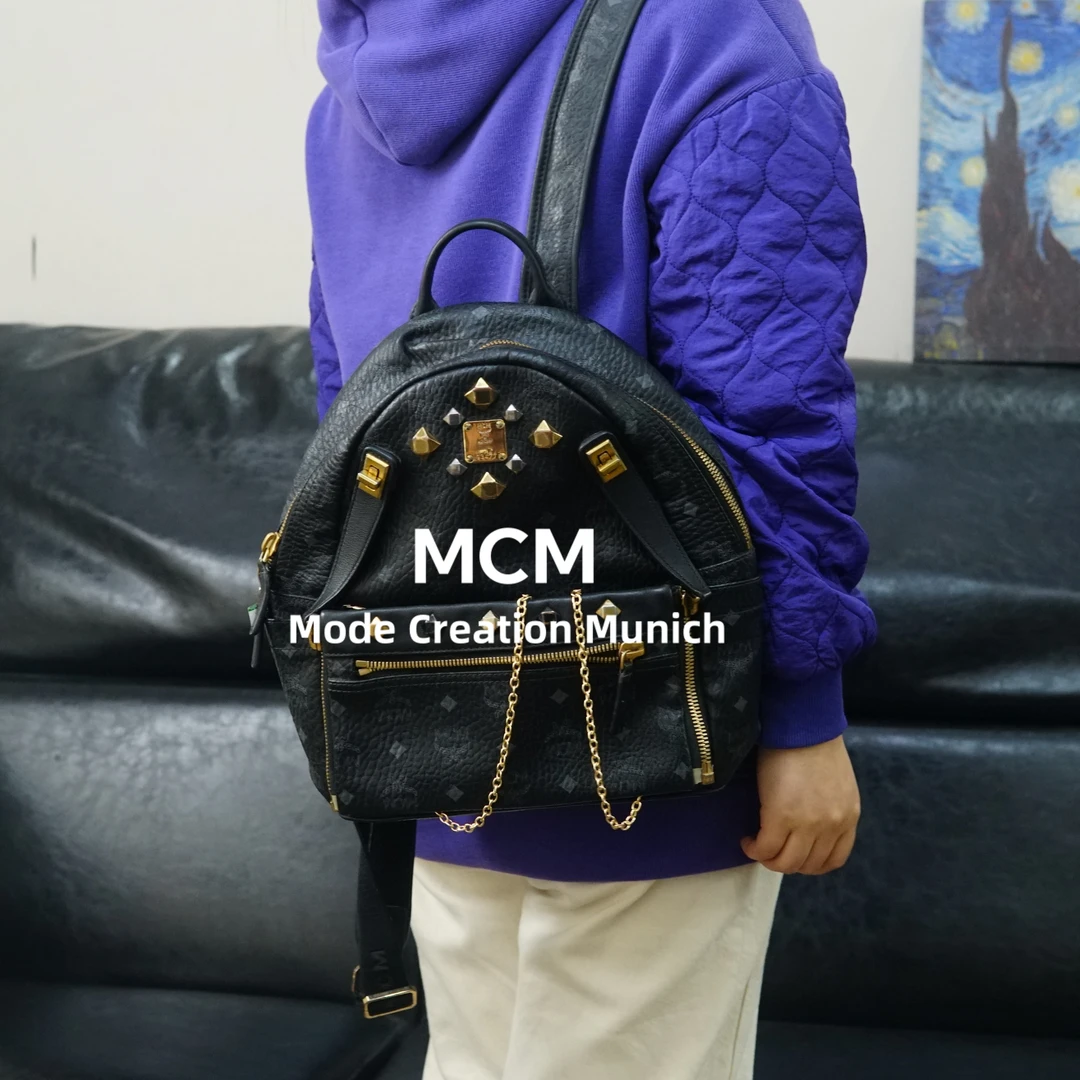 95新 MCM 黑金双肩包/F4BB10427009/7009