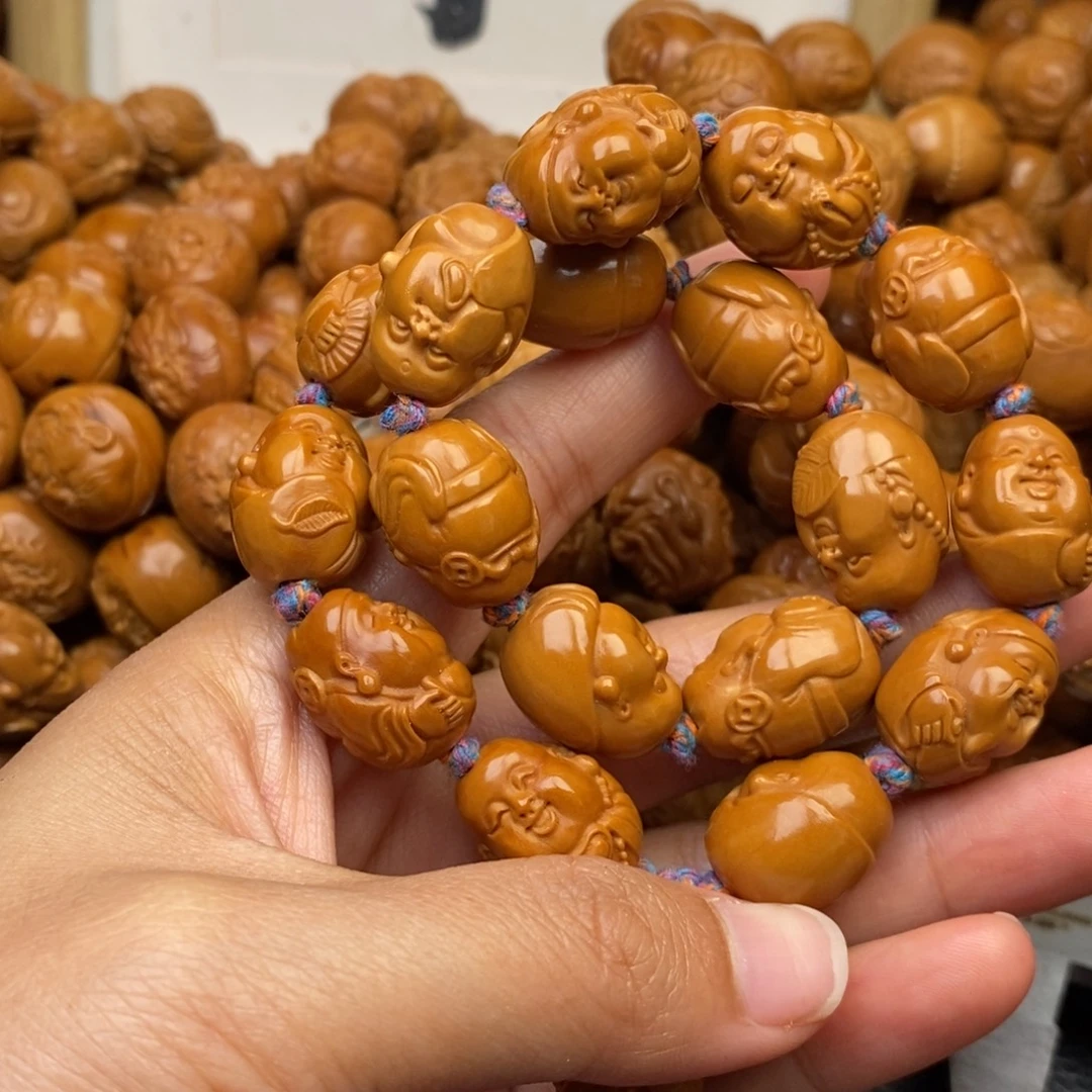 橄榄核吊坠财迷手持