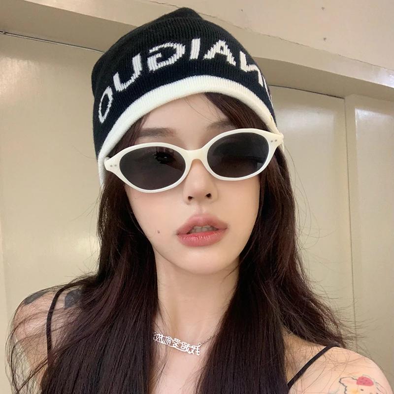 韩系米白椭圆时尚墨镜网红同款女显脸小防紫外线高级感偏光太阳镜