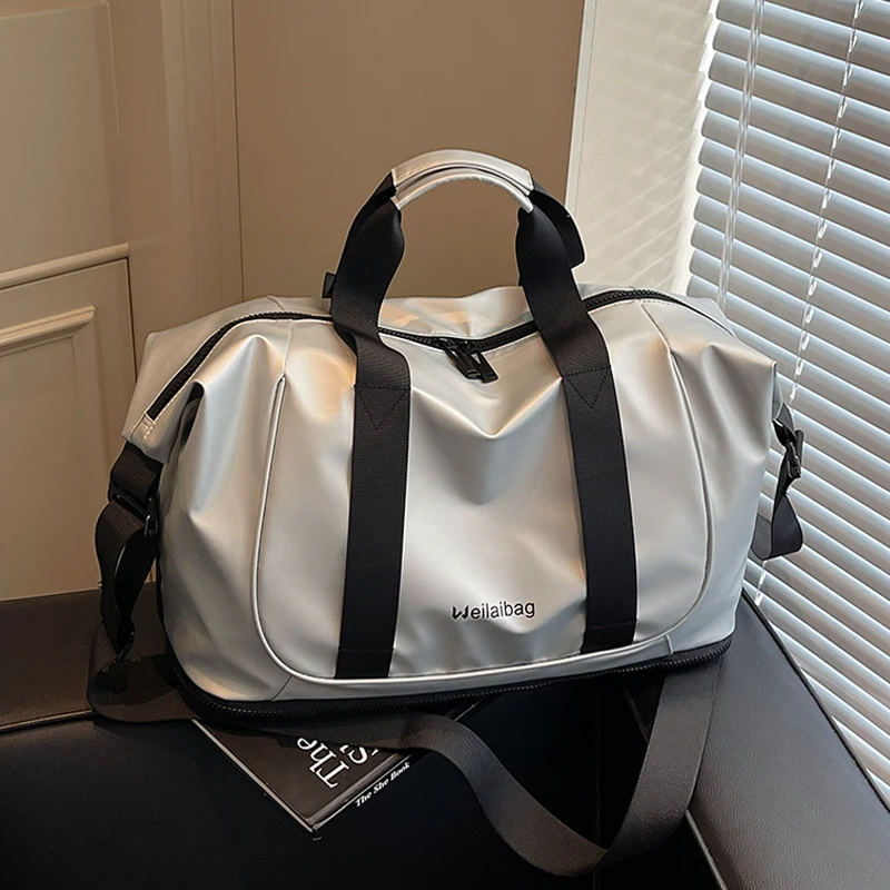 大容量手提短途旅行包女时尚轻便防水出差收纳行李包男运动健身包