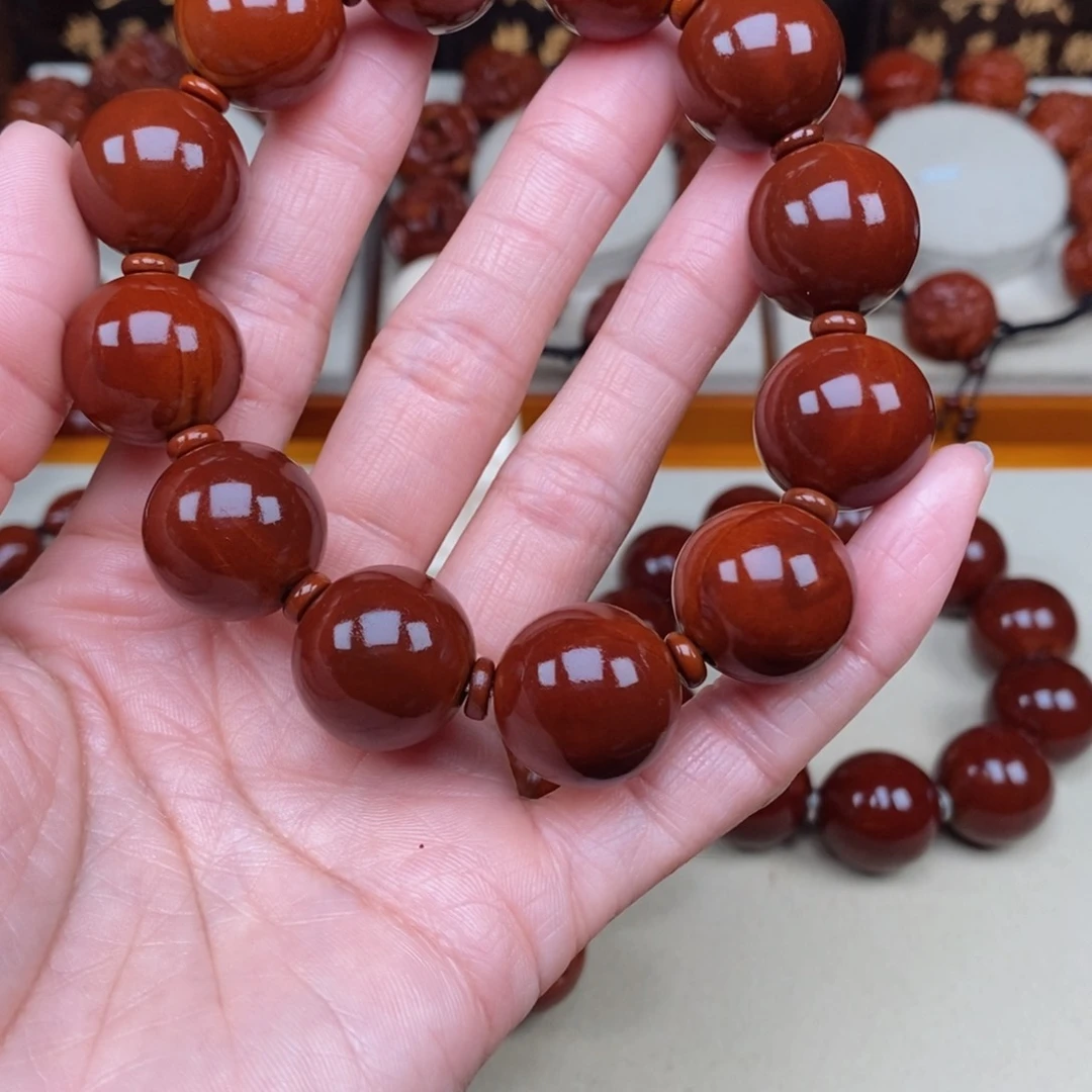 橄榄核吊坠执****悟光珠，